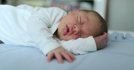 Infant newborn baby sleeping resting in bed