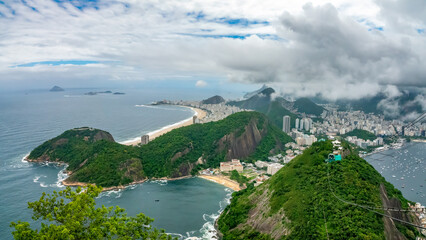Cable car ride to the top of the iconic Sugarloaf mountain with the famous beaches of Rio in the background, Rio de Janeiro, Brazil