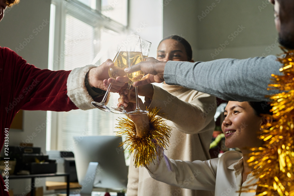 Aufkleber group of happy young intercultural managers toasting with sparkling champagne for good luck in busin
