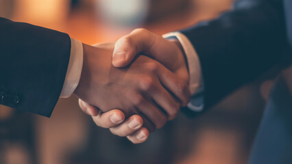 Symbolic handshake of business trust. Partners seal a deal with a firm grip. Professional collaboration in action