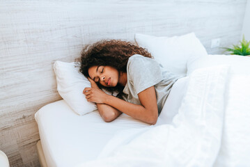 Portrait of woman sleeping in bed - obrazy, fototapety, plakaty