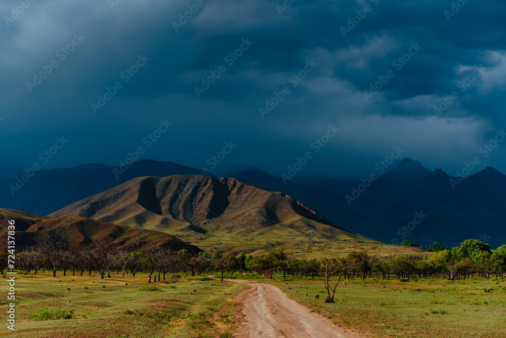 Canvas Prints Picturesque mountain landscape with road in cloudy stormy weather