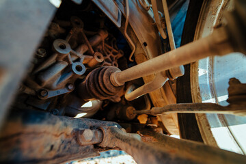Car suspension and axle detailed view, old rusty parts