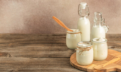 lactose-free milk and yogurt on a wooden background., Allergic food concept, Vegan diet, Long banner format