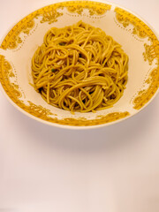 a bowl of pasta noodles on a white background