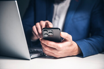 Close-up photo of male hands with smartphone