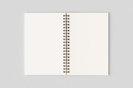 Blank white inside of a kraft spiral notebook mockup.