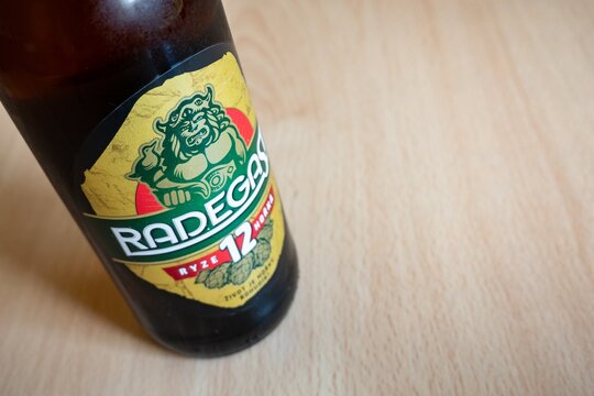 Radegast 12 bitter lager beer glass bottle focused on god logo