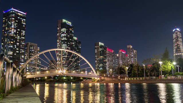 Skyscraper building with bridge illumination on songdo river in central park at Incheon, South Korea