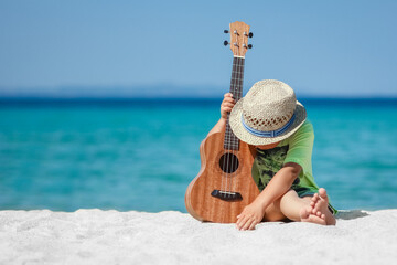 A happy child with ukulele at iorya in nature weekend travel