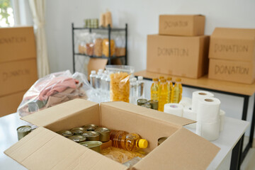 Warehouse of charity organization with food, clothes and toiletries