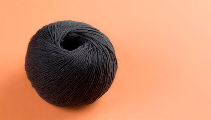 Partially rolled black colored sewing wool ball on peach background. Connections between points, the concept of innovative and computer work. Today's game of Connections. Connections Hints.Copy Space.