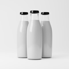 Milk bottles isolated over white background. Dairy products concept. 3D rendering.