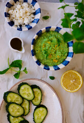 Green pea dip with feta and crostini. top view .