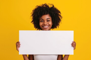 A woman holding a white sign in front of her face. Versatile image for various uses