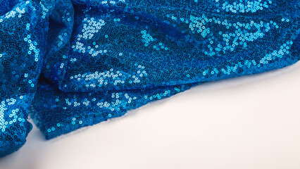 Blue sequins fabrics close up. Copy space