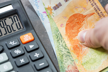 Argentine pesos, financial settlements in Argentina, taxes, Argentine currency exchange rate,...
