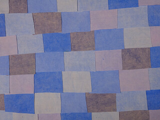 Fototapeta premium Handmade background in patchwork style with cotton fabric elements in blue tones 