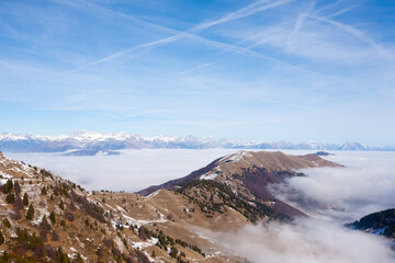 Mountain peaks emerging from the clouds