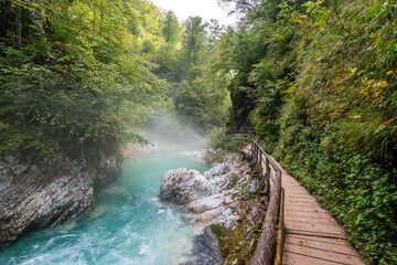 Amazing Vintgar gorge with clean azure water with wooden path in Slovenia