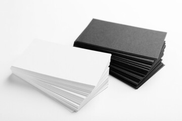 Many blank business cards on white background, closeup. Mockup for design