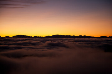 Fototapeta na wymiar Spectacular sunset over a sea of clouds