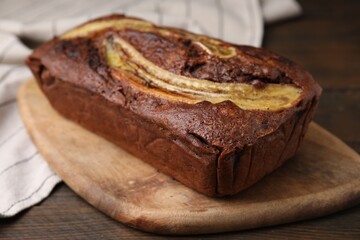 Delicious banana bread on wooden table, closeup