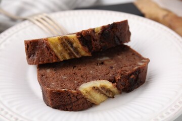 Slices of delicious banana bread served on table, closeup