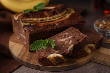 Delicious banana bread on brown table, closeup