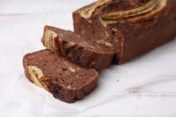 Delicious banana bread on white wooden table, closeup