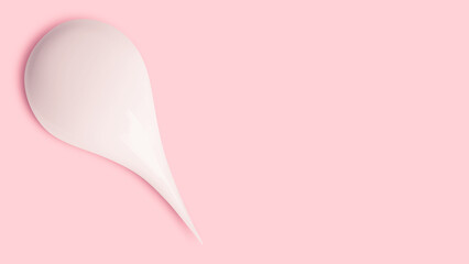 Smears of white cream on pink background