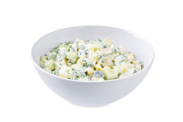 Egg cucumber avocado salad with mayonnaise sauce in a bowl on a white isolated background