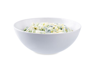 Egg cucumber avocado salad with mayonnaise sauce in a bowl on a white isolated background