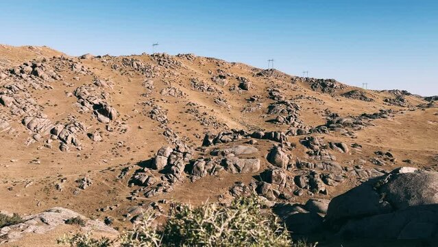 The Valley of Demons in Uzbekistan in the Samarkand region. Boulders, granite sculptures, huge boulders of bizarre shapes in the spurs of the Zaravshansky ridge. 4K Video