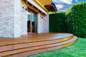 Luxury villa exterior with garden terrace and wooden exotic floor. - 724188242