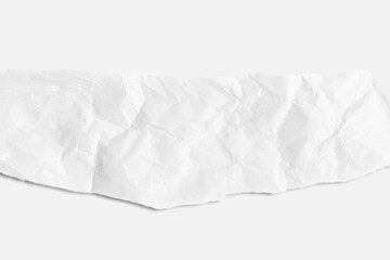 Obraz premium Scrap of crumpled white paper on light background