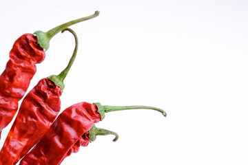 Dried chili peppers on a white background. Dried spices. close-up