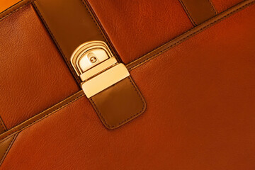 Briefcase from genuine leather close-up, texture. Detail of leather briefcase, metal clasp,...