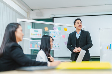 Group of multiethnic business people working and talking discussion in modern office, Businessman and businesswoman sitting around a conference table of business meeting seminar room