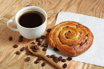 Coffee and raisins puff pastry roll