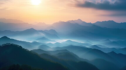 Obraz premium Beautiful rocky mountainous landscape at orange dawn with sun through the clouds