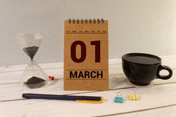 March 1 calendar date text on wooden blocks with blurred park background. Copy space and calendar concept