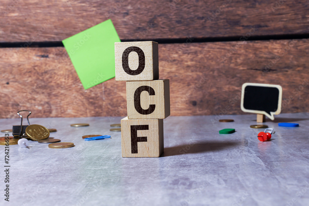 Poster text ocf on wood cube block, stock concept. ocf - this is cash that comes from the operating activit