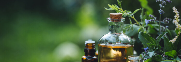 Concept of pure organic essential oil in glass bottles in cosmetology. Moisturising skin care,...