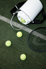Tennis Essentials: Racket, Balls, and Bag on Court