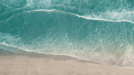 Drone aerial view of paradise beach. Turquoise sea water and clear sand at sunset. - Powered by Adobe