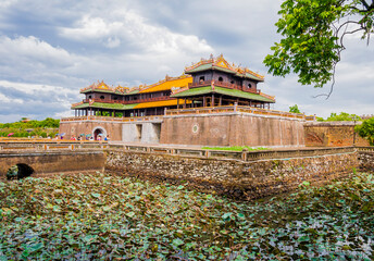 Tourists sightseeing the imperial citadel of Hue entering through the meridian gate, Vietnam
- 724228419