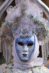 Masked person during the first day of the Venice carnival
