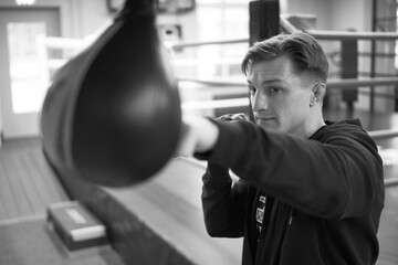 boxer practice, coaching or sports training at gym. Male person professional fighter in late...