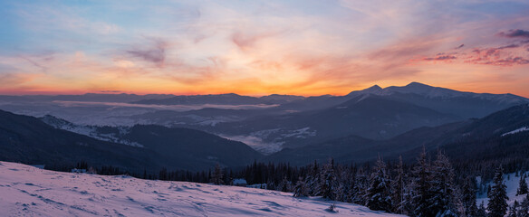 Picturesque winter alps sunrise. Highest ridge of the Ukrainian Carpathians is Chornohora with peaks of Hoverla and Petros mountains. View from Svydovets ridge and Dragobrat ski resort. - obrazy, fototapety, plakaty
